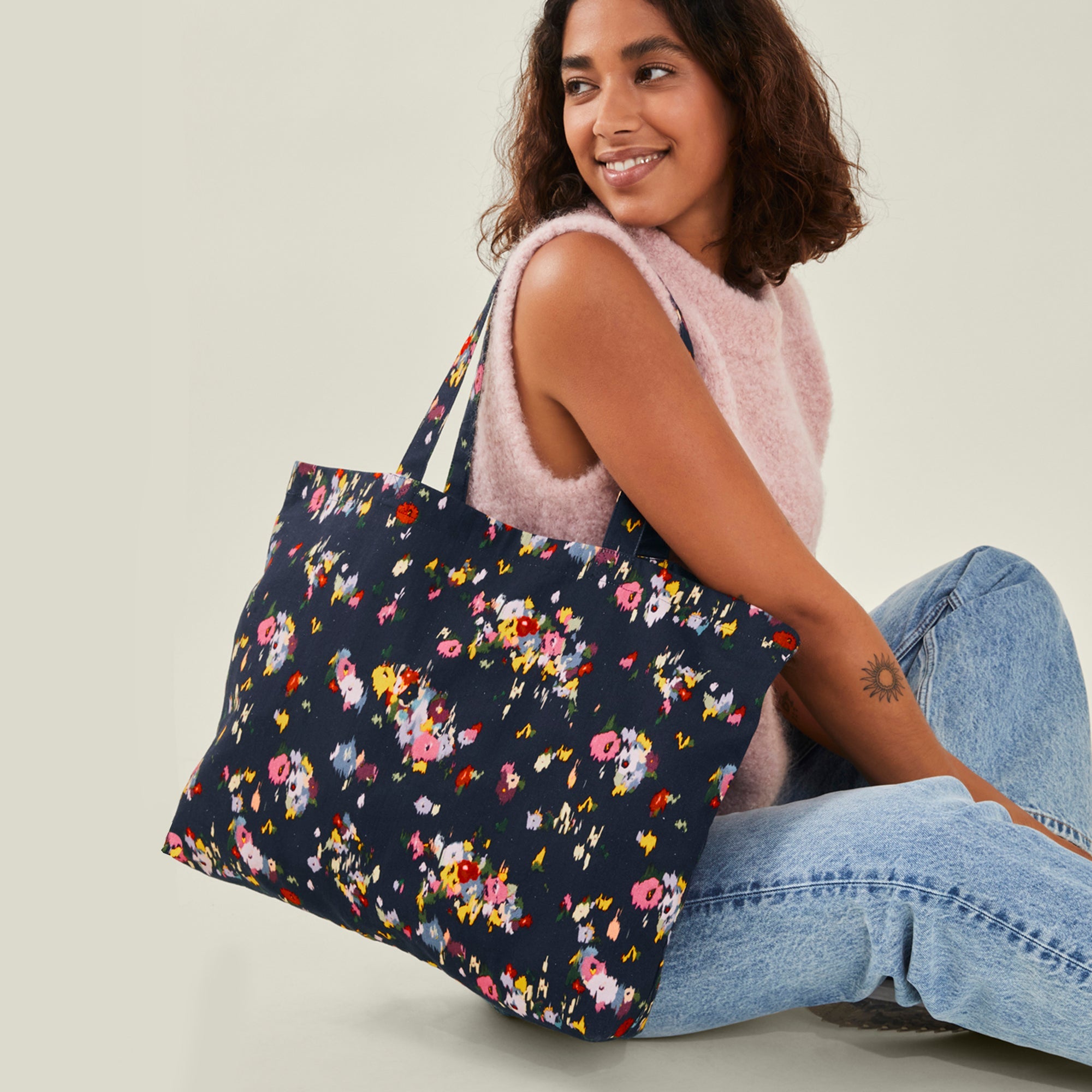 Navy floral handbag on sale