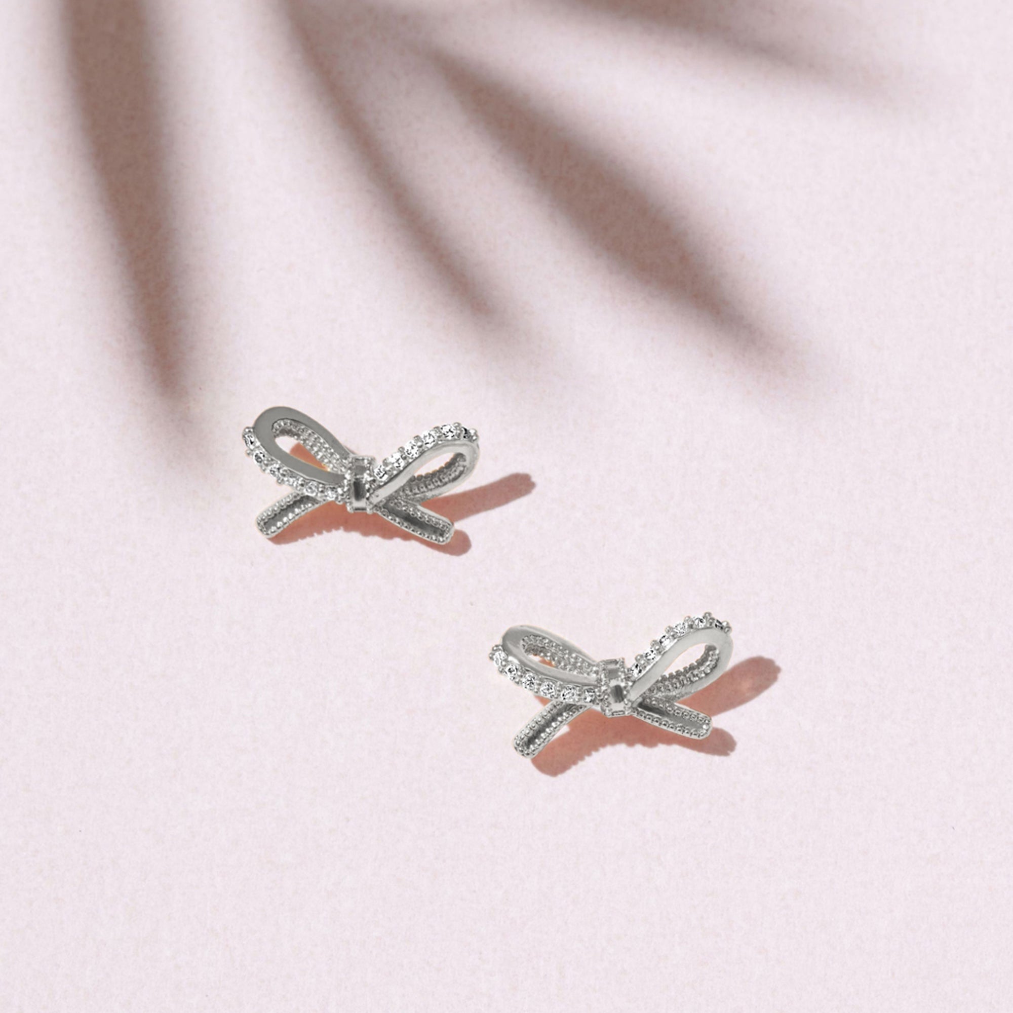 Sterling Silver-Plated Diamante Bow Stud Earrings