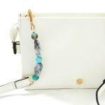 Accessorize London women's Faux Leather White Beaded Strap Sling bag