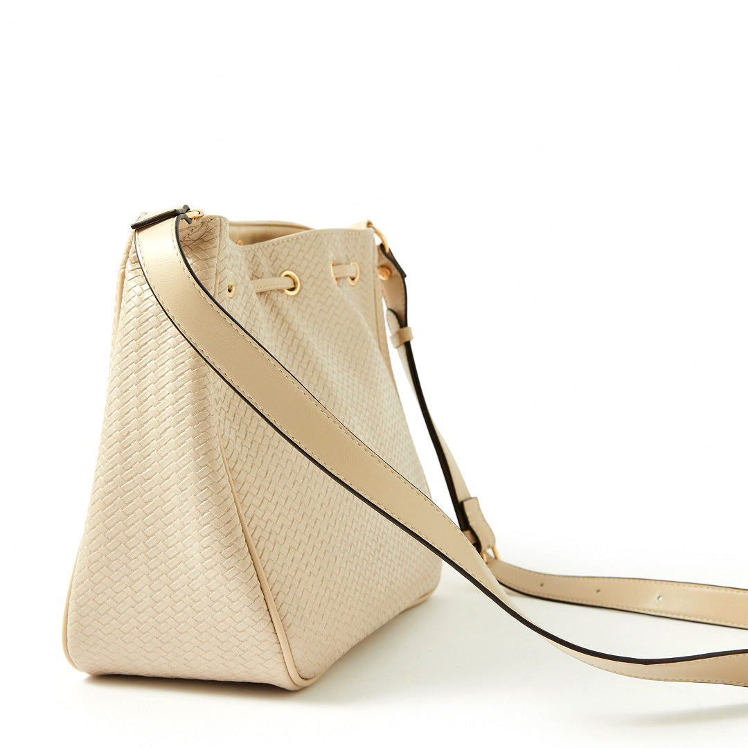 Accessorize London women's Faux Leather Cream Drawstring Weave Sling bag