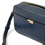 Accessorize London women's Faux Leather Navy Piper Sling bag