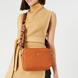 Accessorize London Women's Faux Leather Orange Leopard strap camera Sling bag